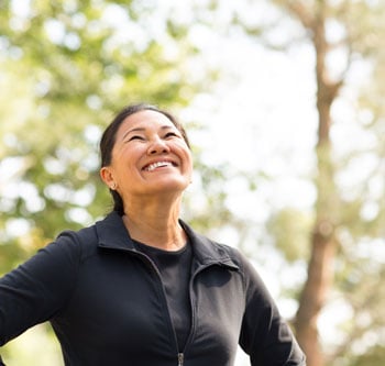 Woman smiling in park