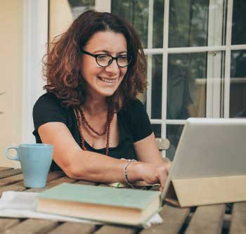 A middle-aged woman on her laptop