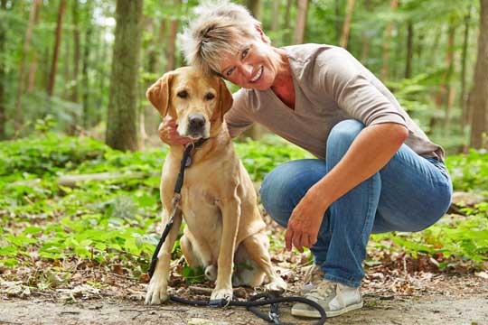 Woman posing with her dog