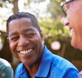 Man in blue shirt smiling